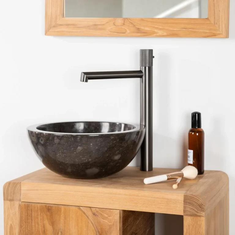 Vasque de salle de bain ronde en marbre noir, posée sur un meuble en bois avec robinet haut