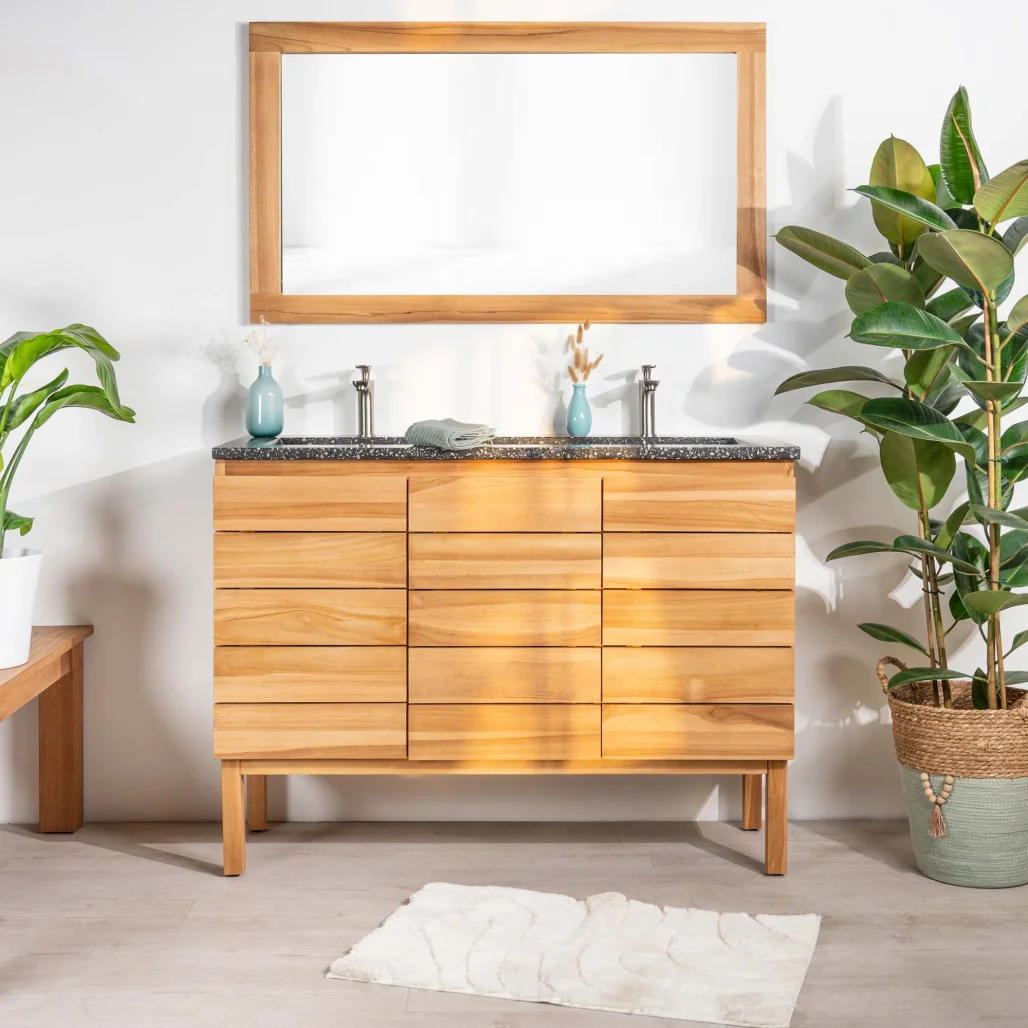 Meuble de salle de bain en bois avec plan vasque en terrazzo noir et double robinet, posé sur pieds